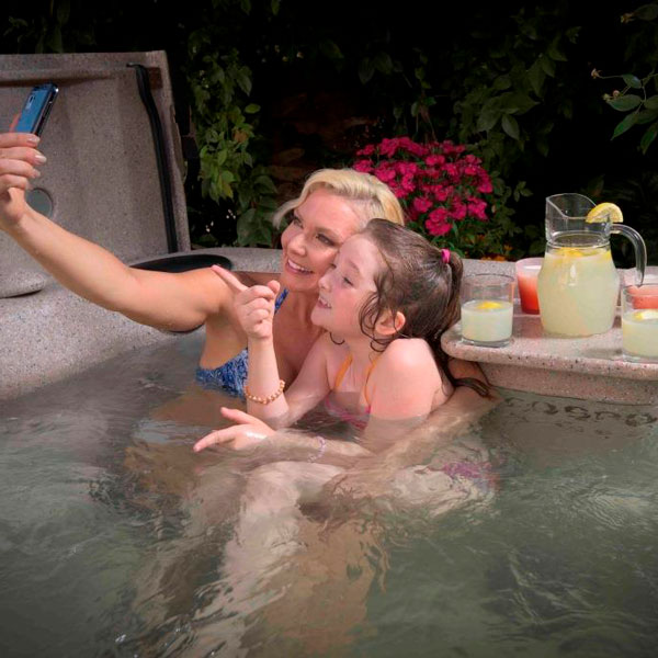 mom and daughter taking a selfie in an eco spa